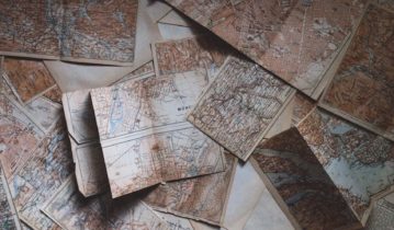 Old maps scattered on a table