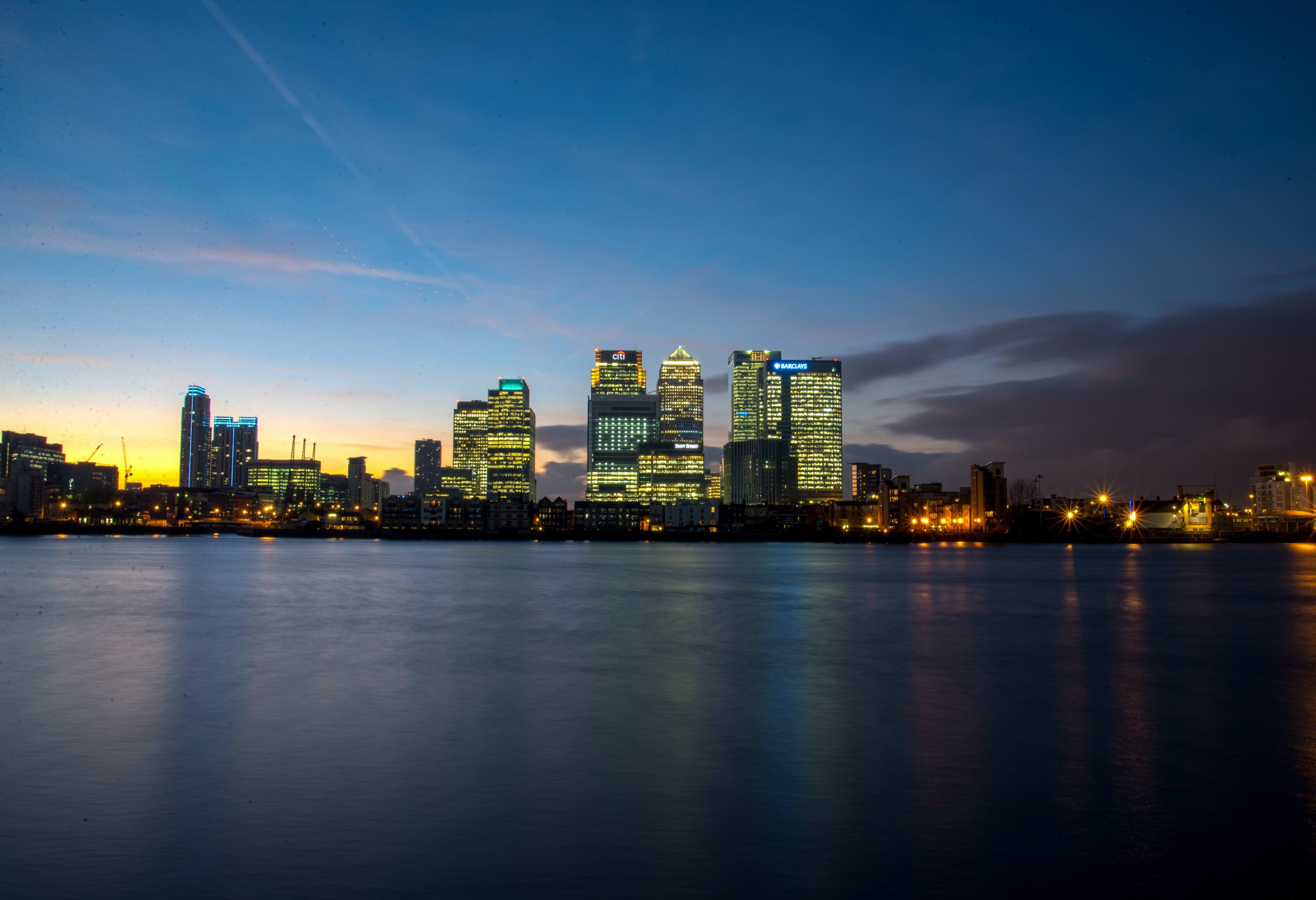 looking at buildings over the water