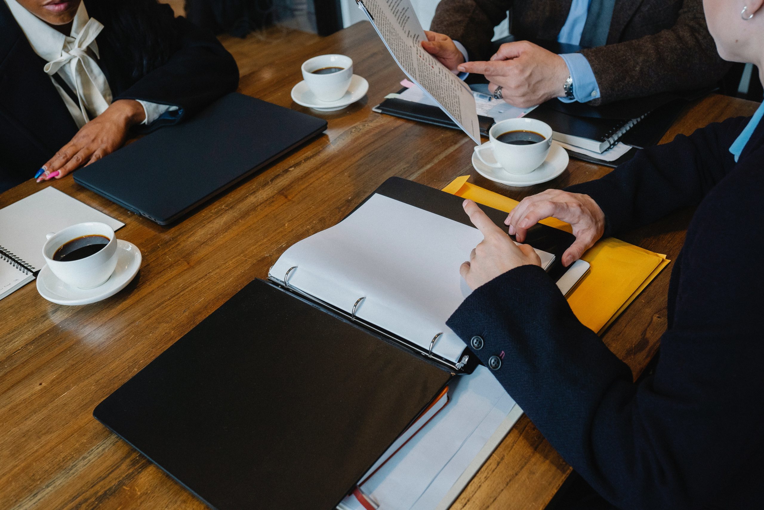three people having a meeting