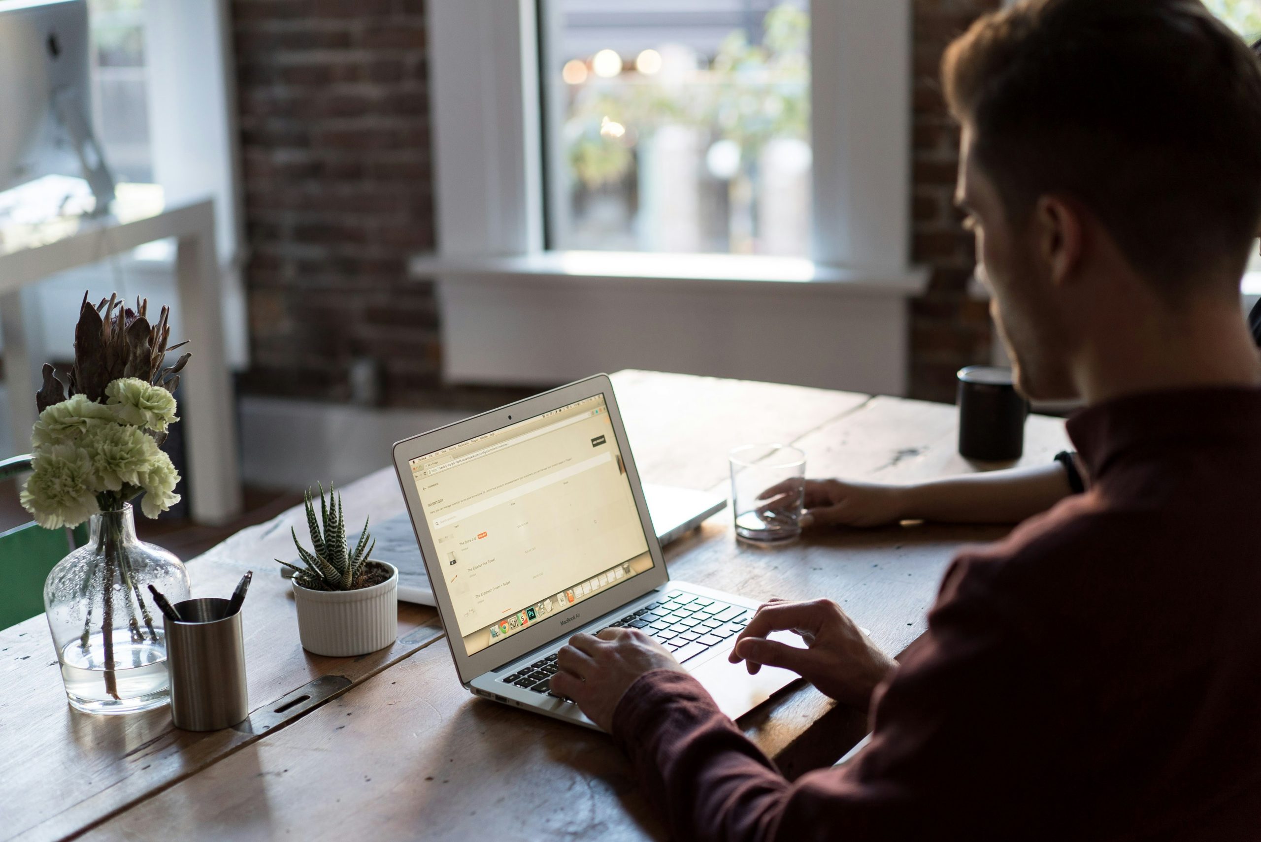 image of man on laptop at desk