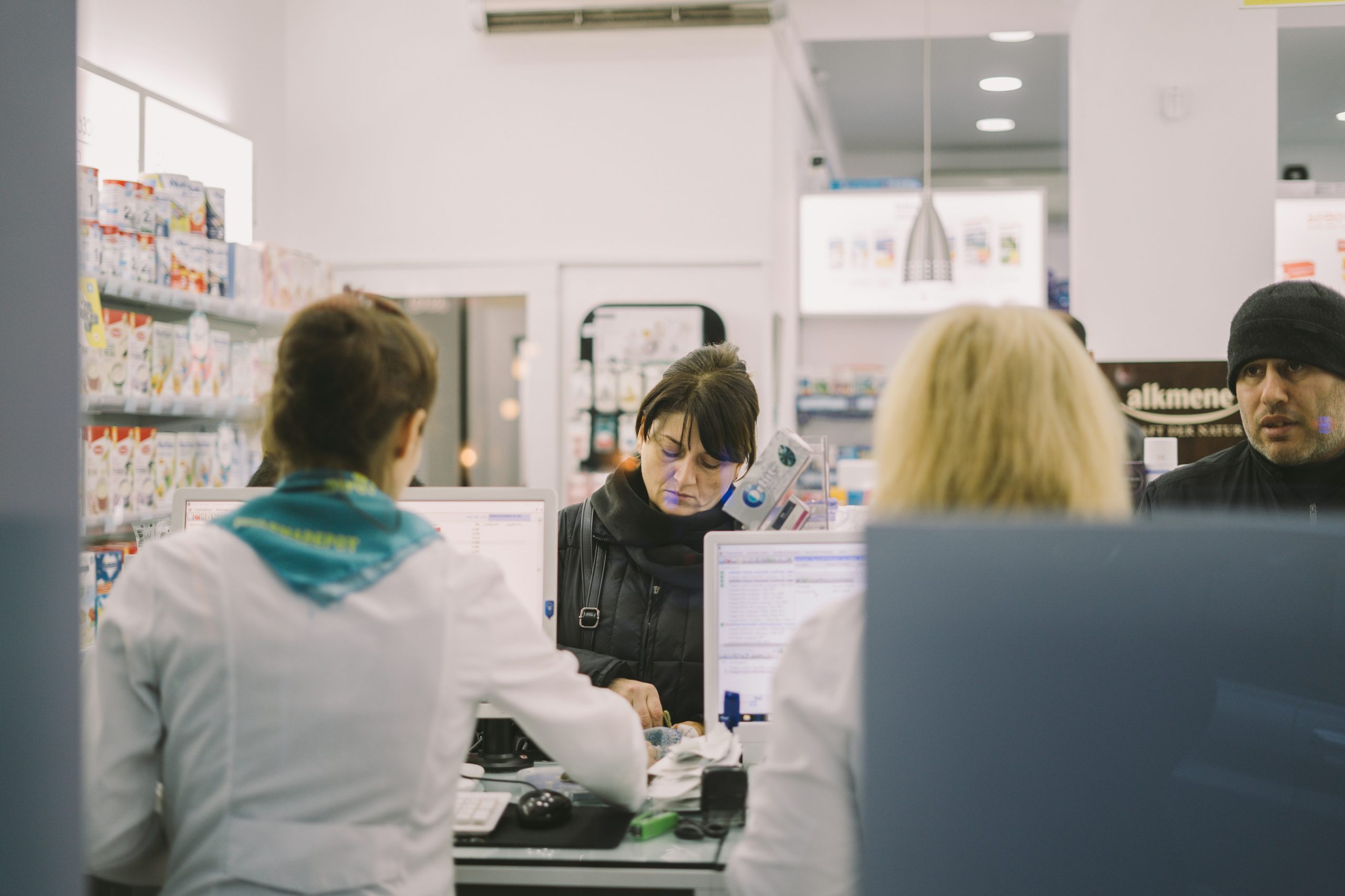 Image of people being served as pharmacy